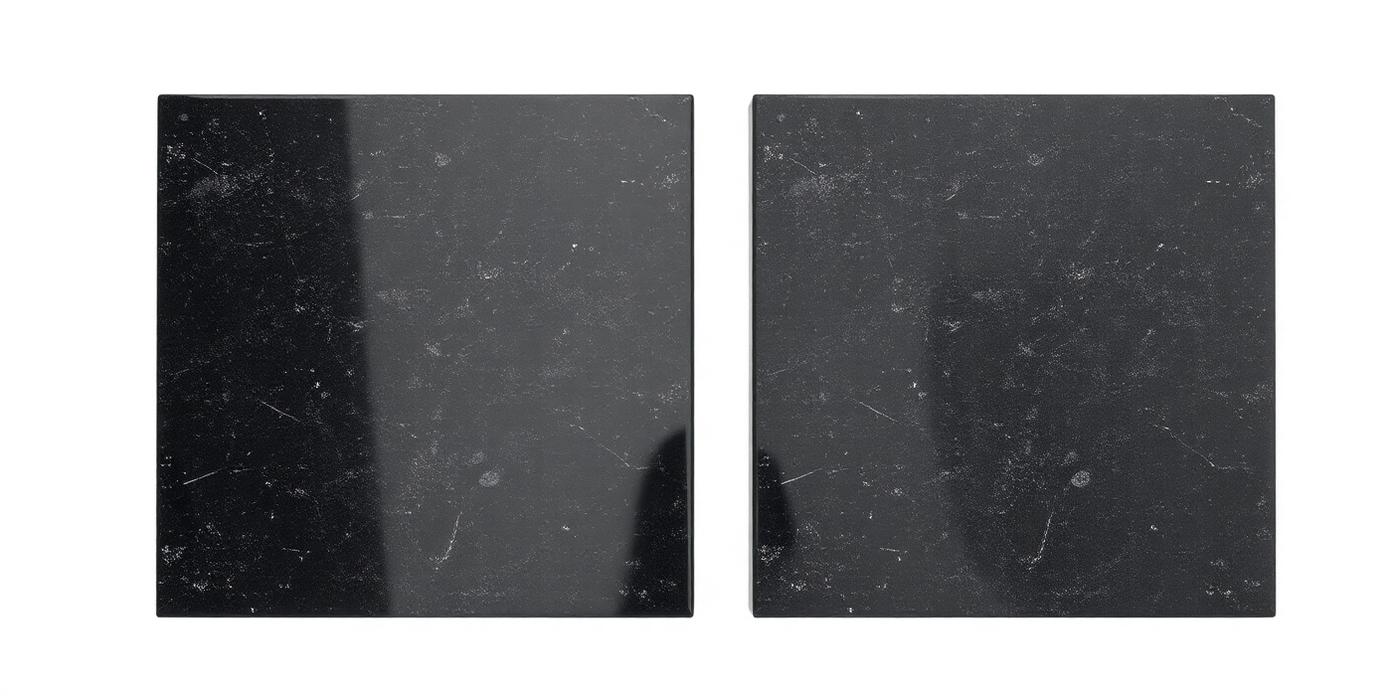 Side-by-side polished surface comparison — premium versus standard black granite