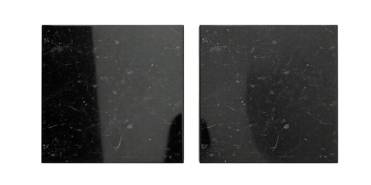 Range of granite headstone color samples including black, red, blue, and mahogany