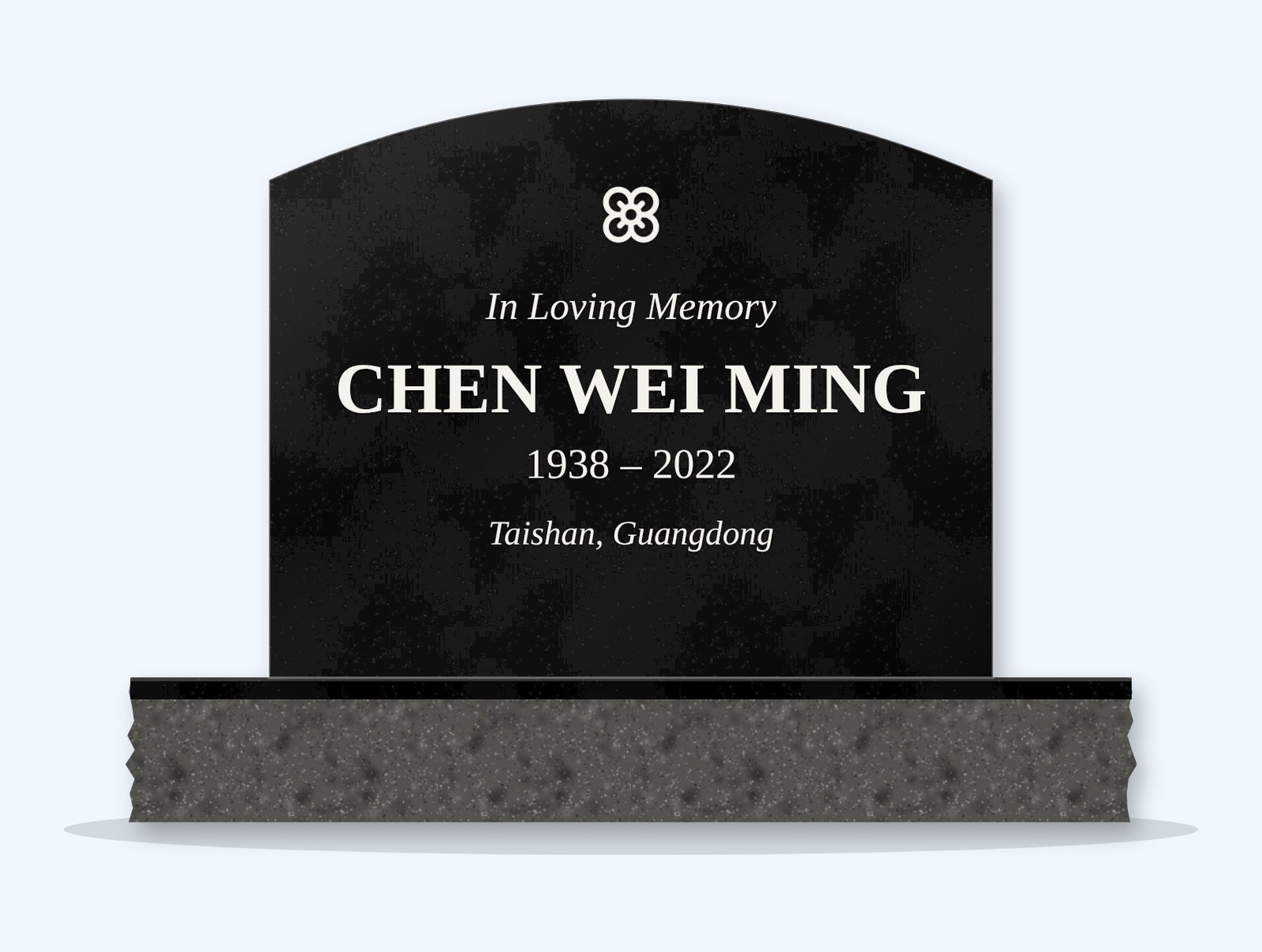 Absolute Black curved top headstone on a granite base, engraved for Chen Wei Ming