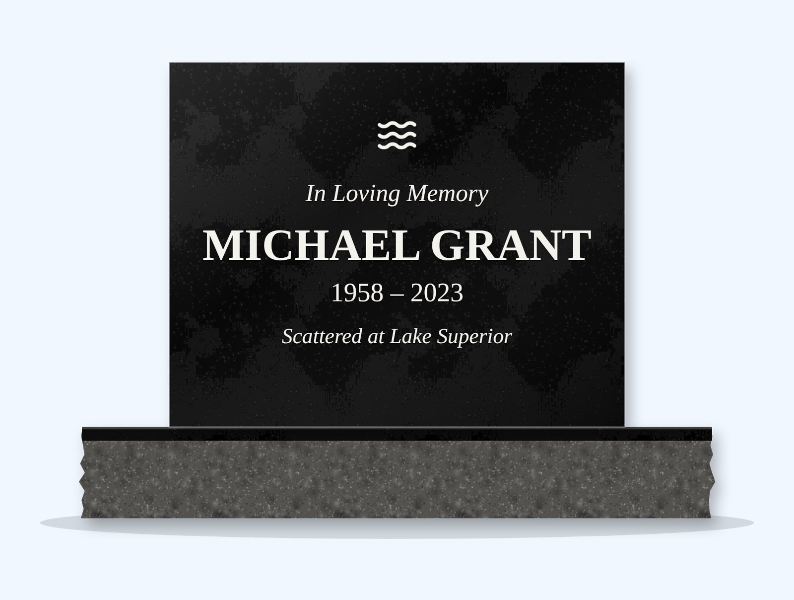 Absolute Black rectangle headstone on a granite base, engraved for Michael Grant