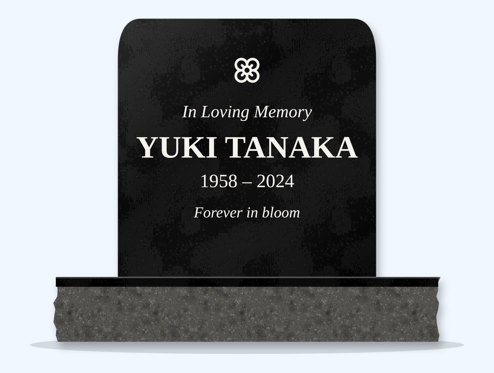 Absolute Black rounded top headstone on a granite base, engraved for Yuki Tanaka