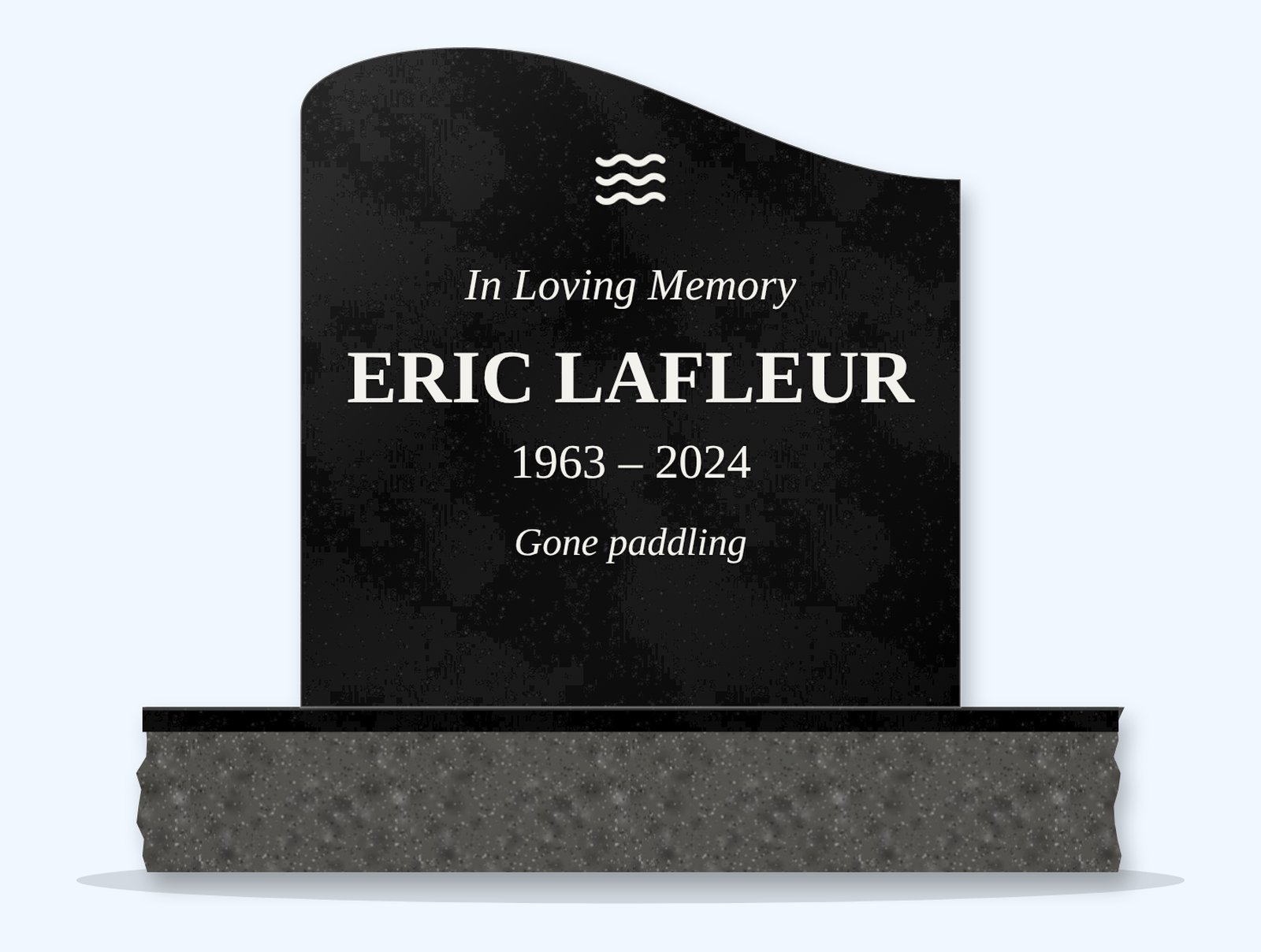 Absolute Black left wave headstone on a granite base, engraved for Eric Lafleur