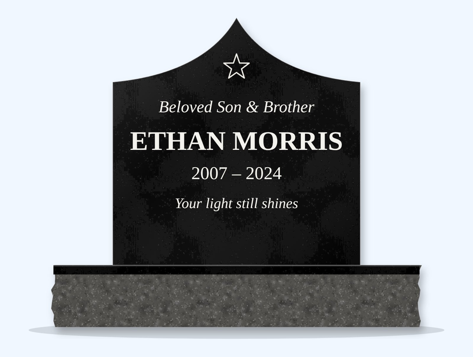Absolute Black curved gable headstone on a granite base, engraved for Ethan Morris