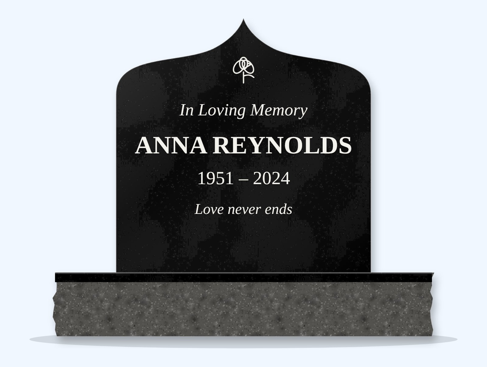 Absolute Black ogee arch headstone on a granite base, engraved for Anna Reynolds