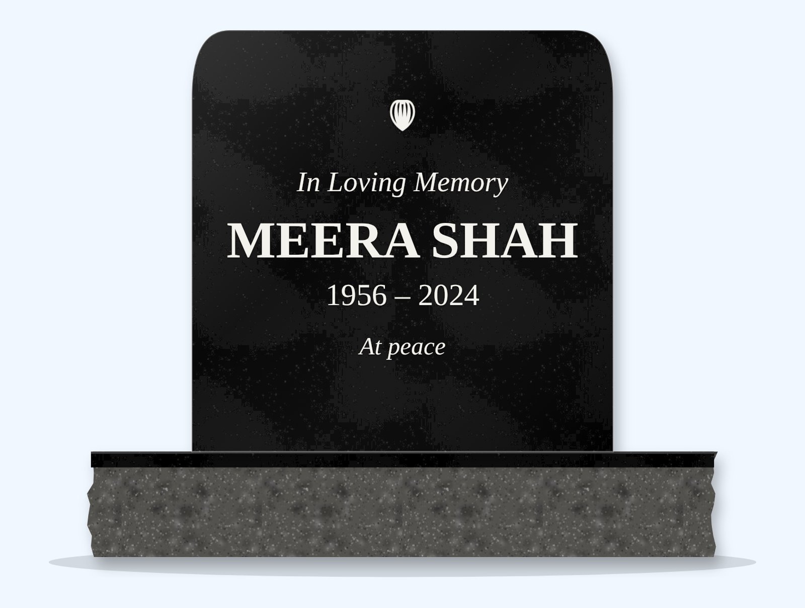 Absolute Black rounded top headstone on a granite base, engraved for Meera Shah
