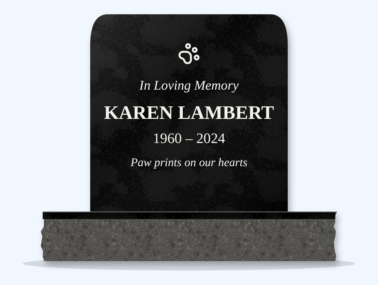 Absolute Black rounded top headstone on a granite base, engraved for Karen Lambert
