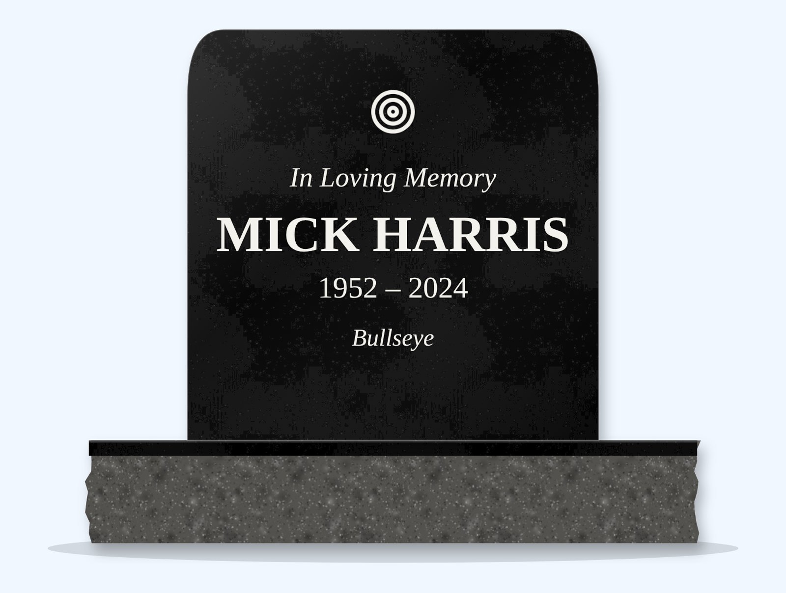 Absolute Black rounded top headstone on a granite base, engraved for Mick Harris