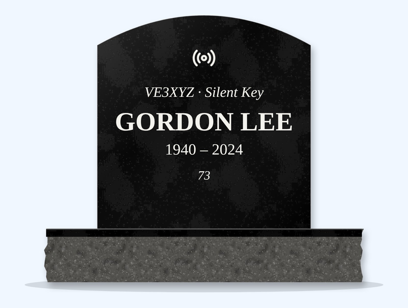Absolute Black curved top headstone on a granite base, engraved for Gordon Lee