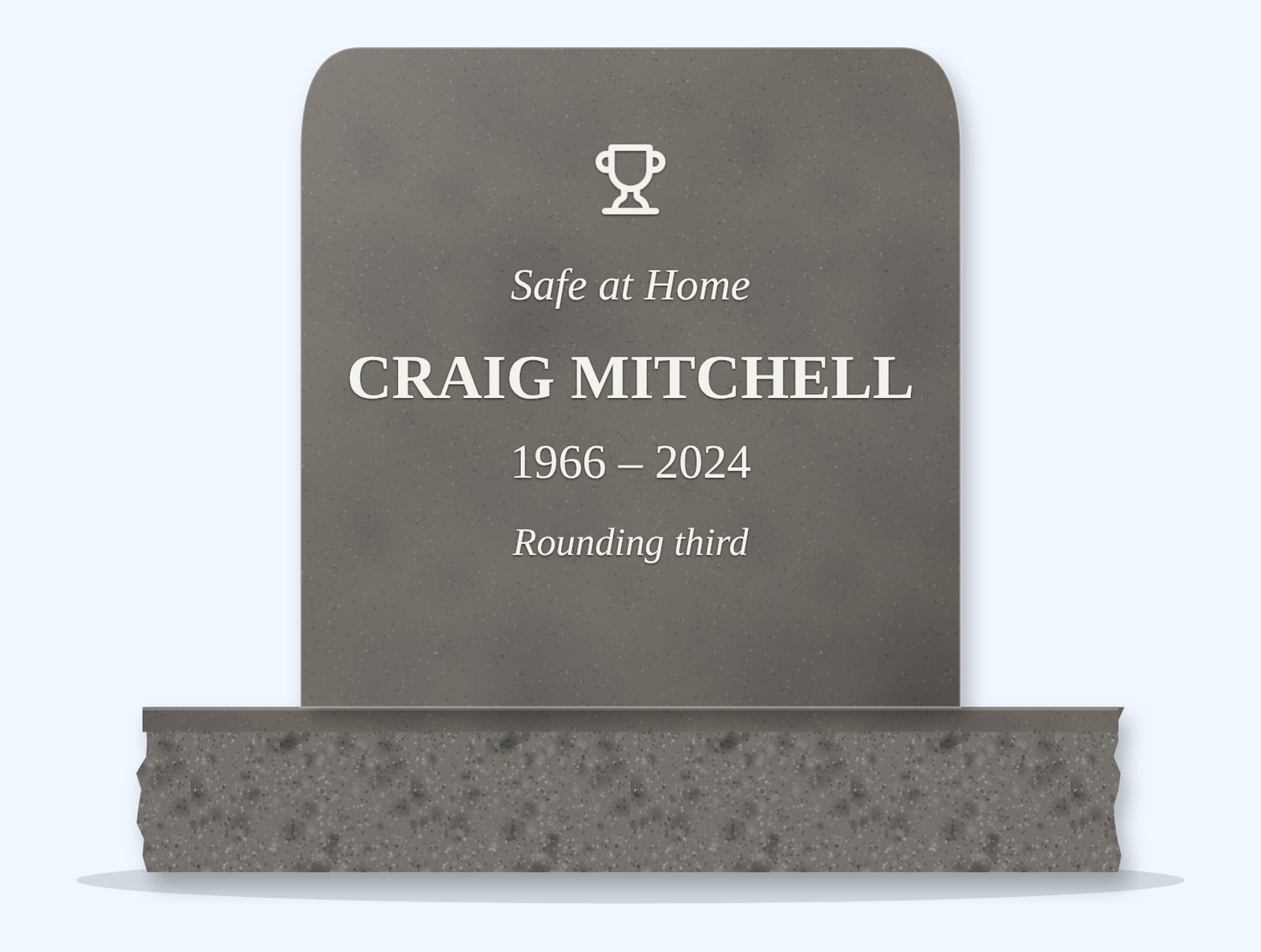 Steel Grey rounded top headstone on a granite base, engraved for Craig Mitchell