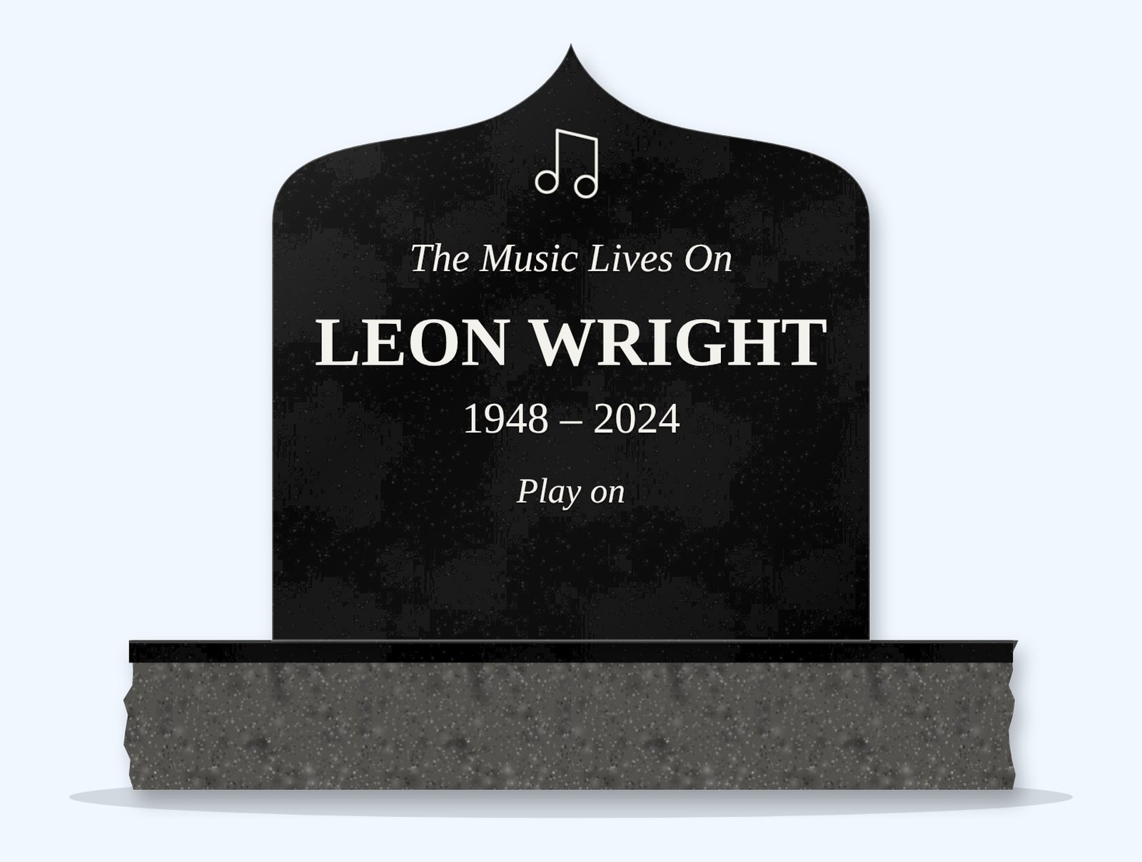 Absolute Black ogee arch headstone on a granite base, engraved for Leon Wright