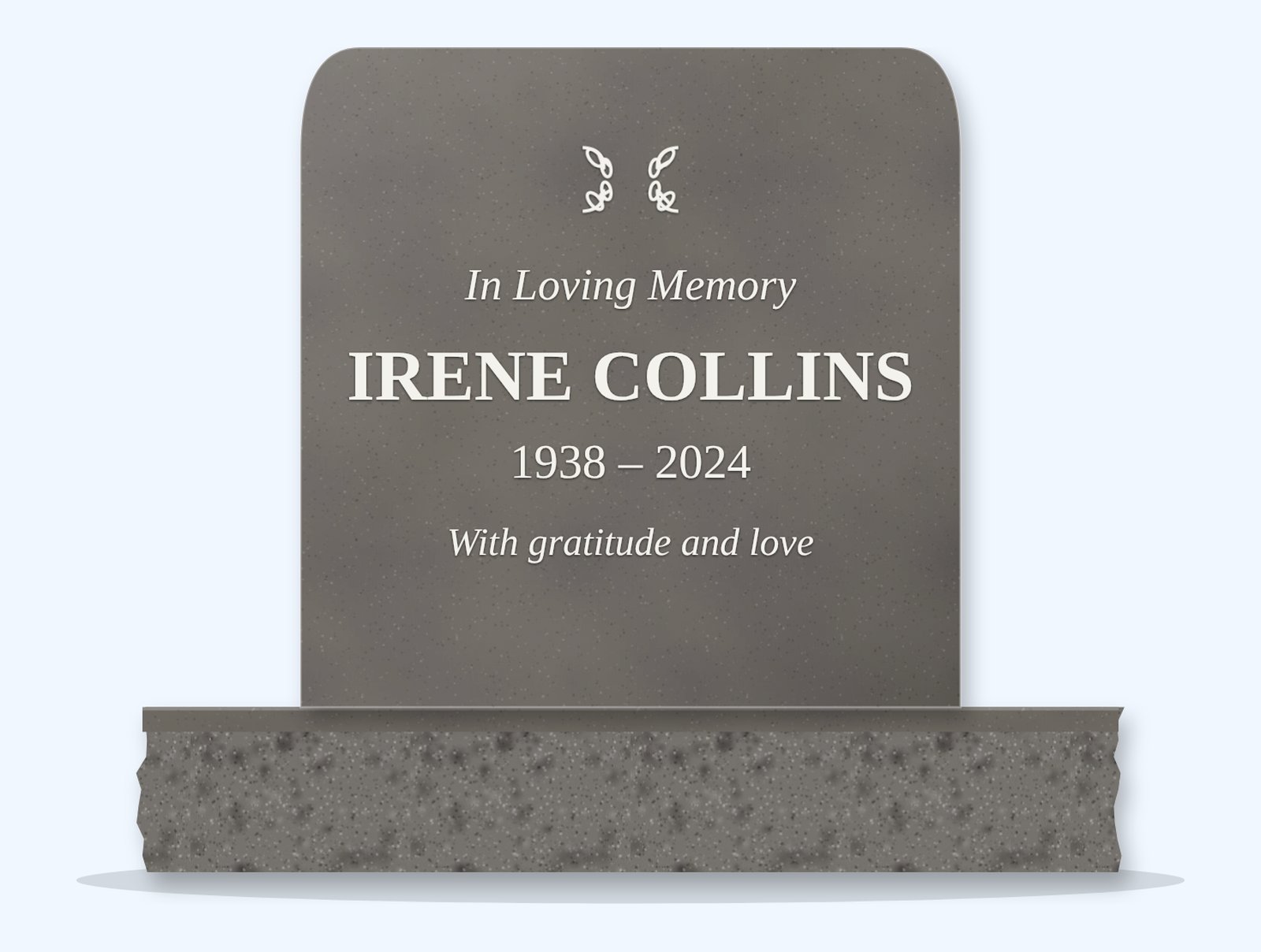 Steel Grey rounded headstone on a granite base, engraved for Irene Collins