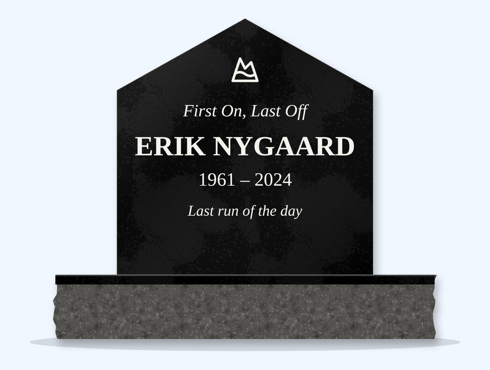 Absolute Black gable headstone on a granite base, engraved for Erik Nygaard