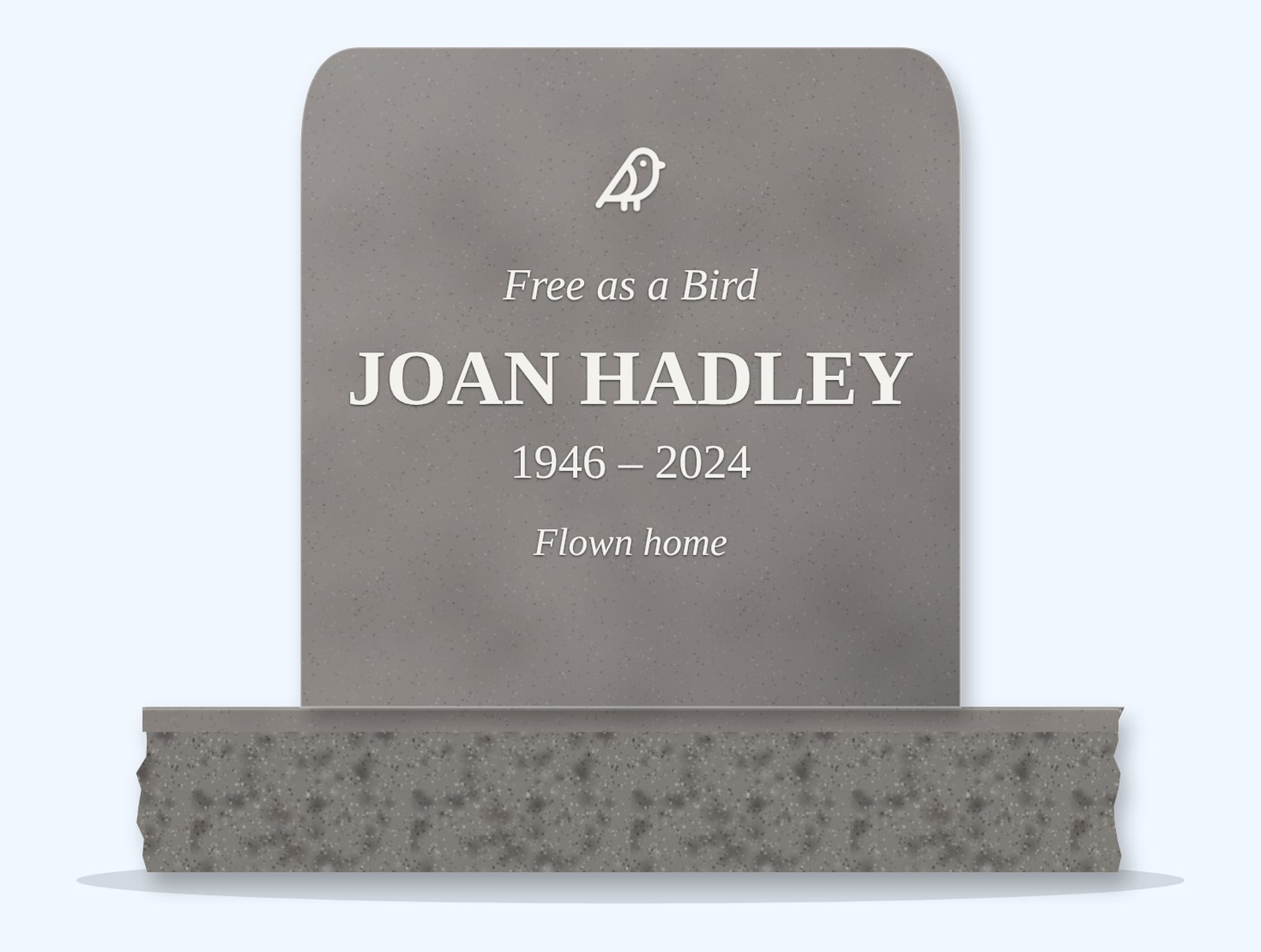 Indian Grey rounded headstone on a granite base, engraved for Joan Hadley