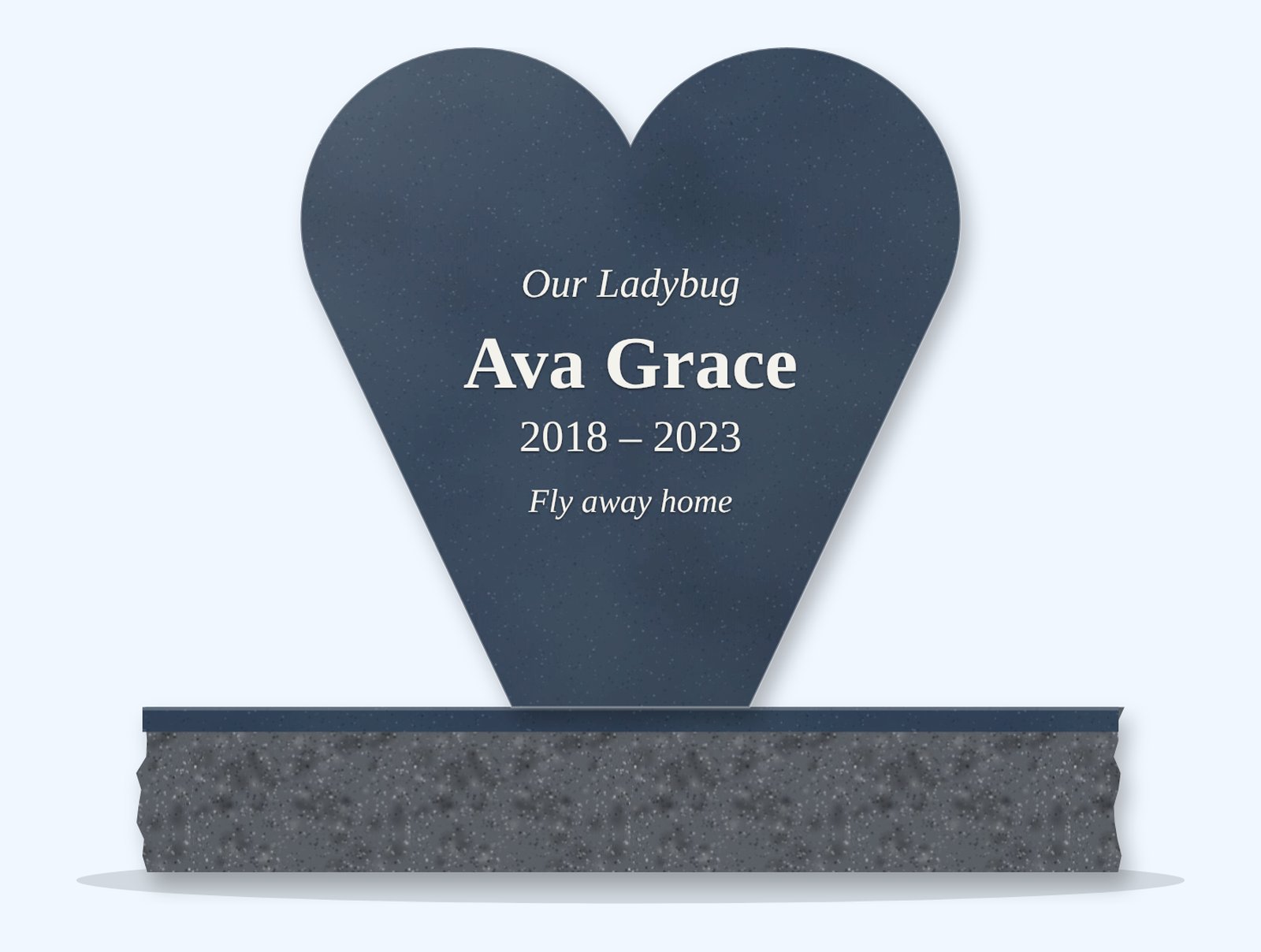 Blue Pearl heart-shaped headstone on a granite base, engraved for Ava Grace