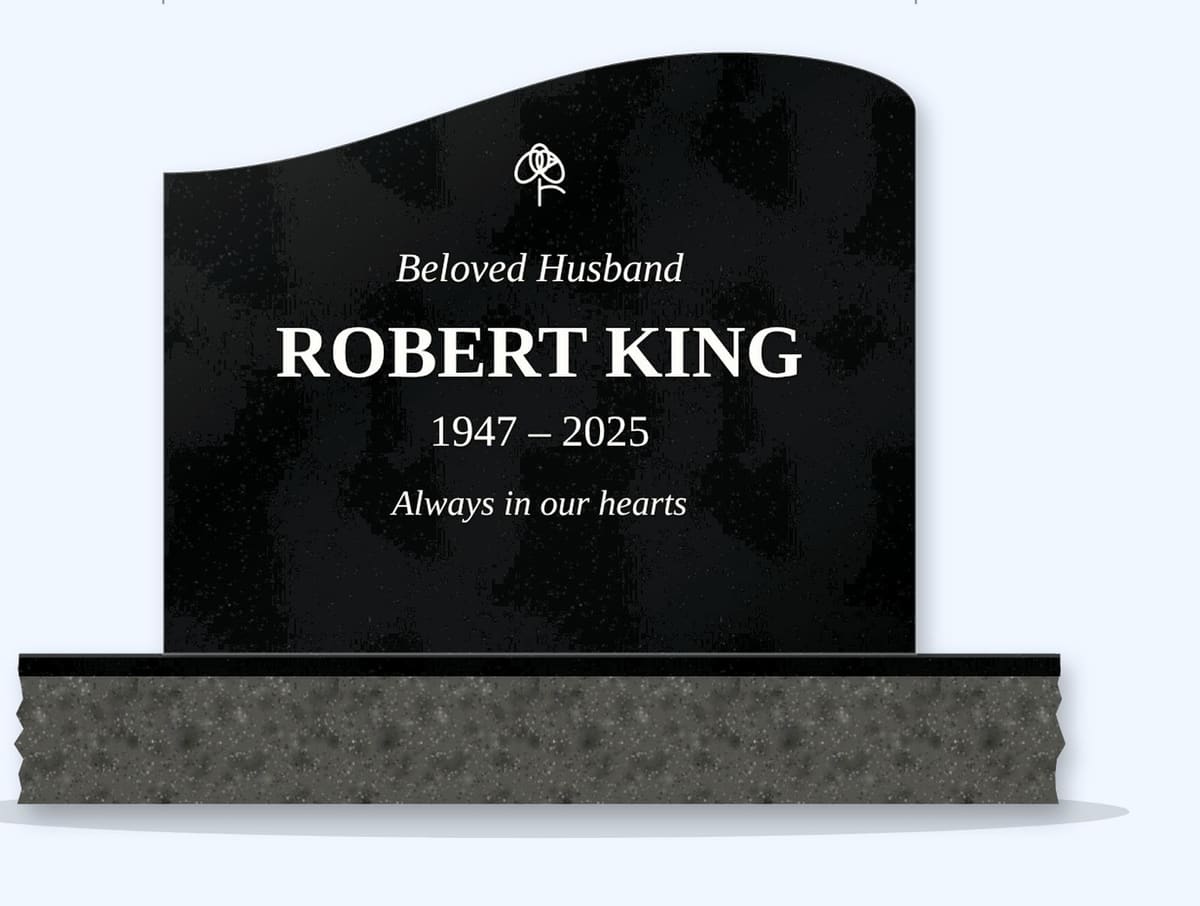 Absolute Black right wave headstone on a granite base, engraved for Robert King