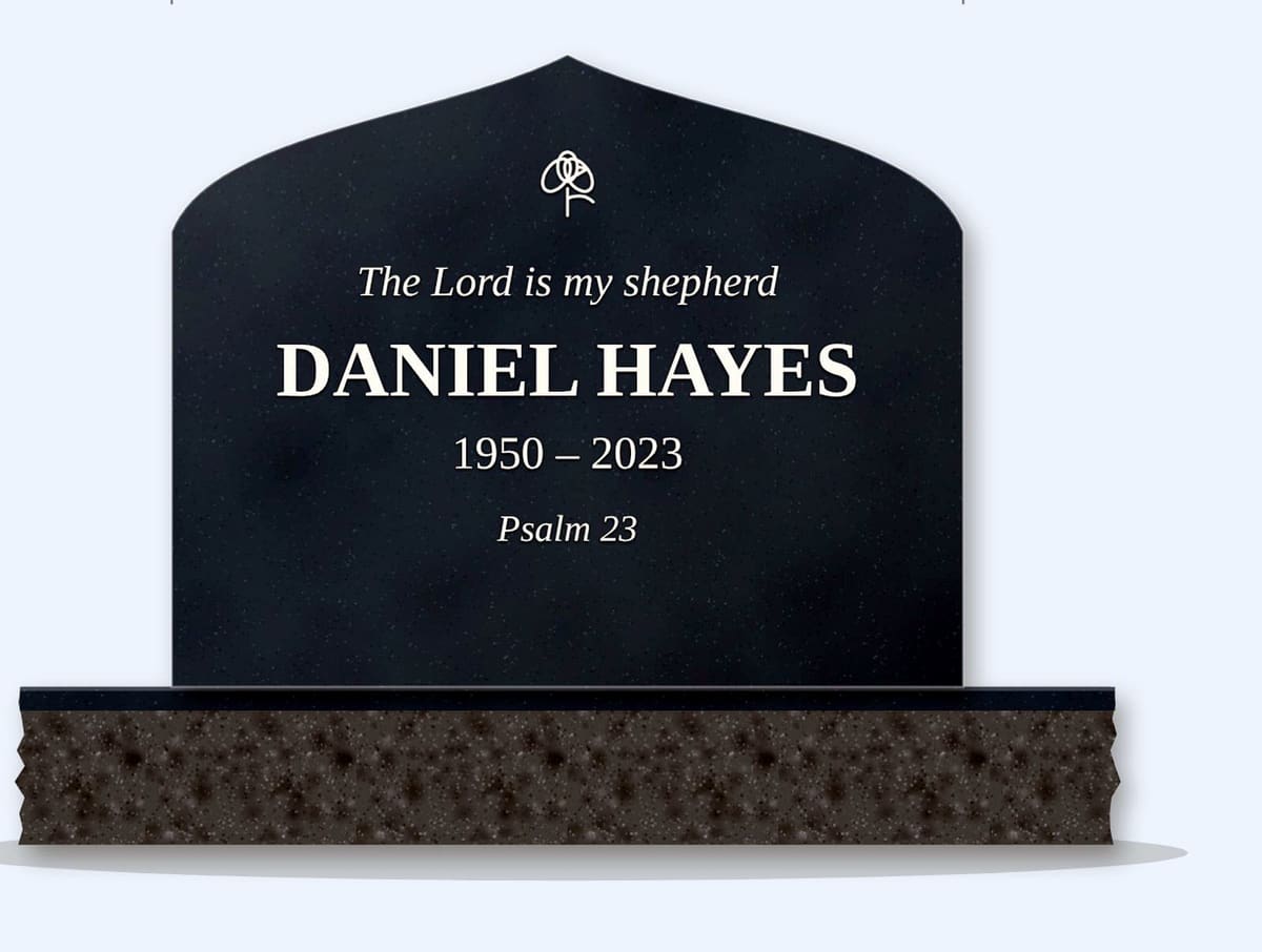 Bahamas Blue curved peak headstone on a granite base, engraved for Daniel Hayes