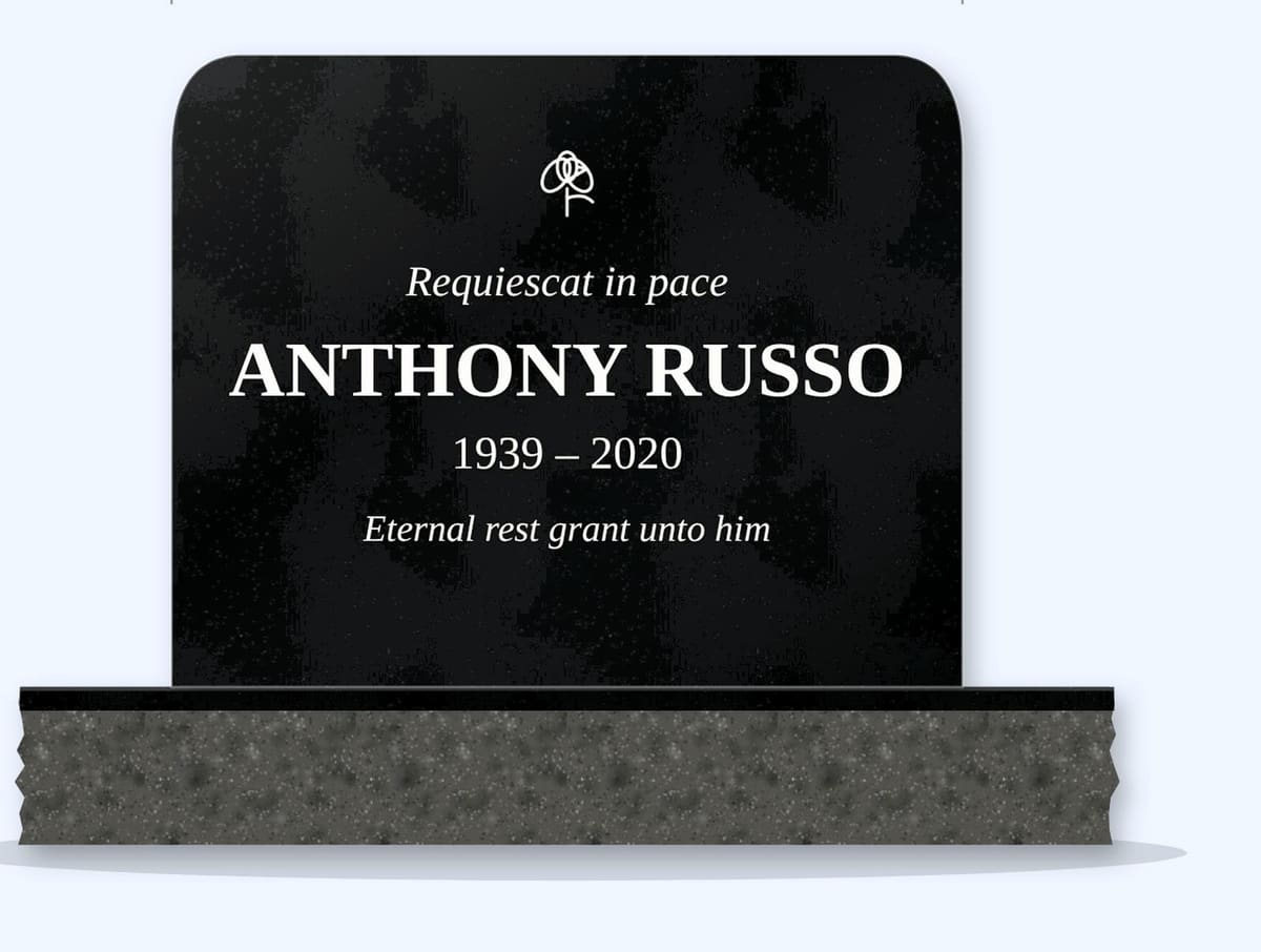 Absolute Black rounded top headstone on a granite base, engraved for Anthony Russo