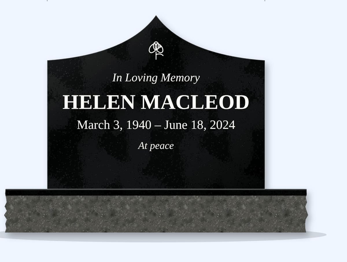 Absolute Black curved gable headstone on a granite base, engraved for Helen MacLeod