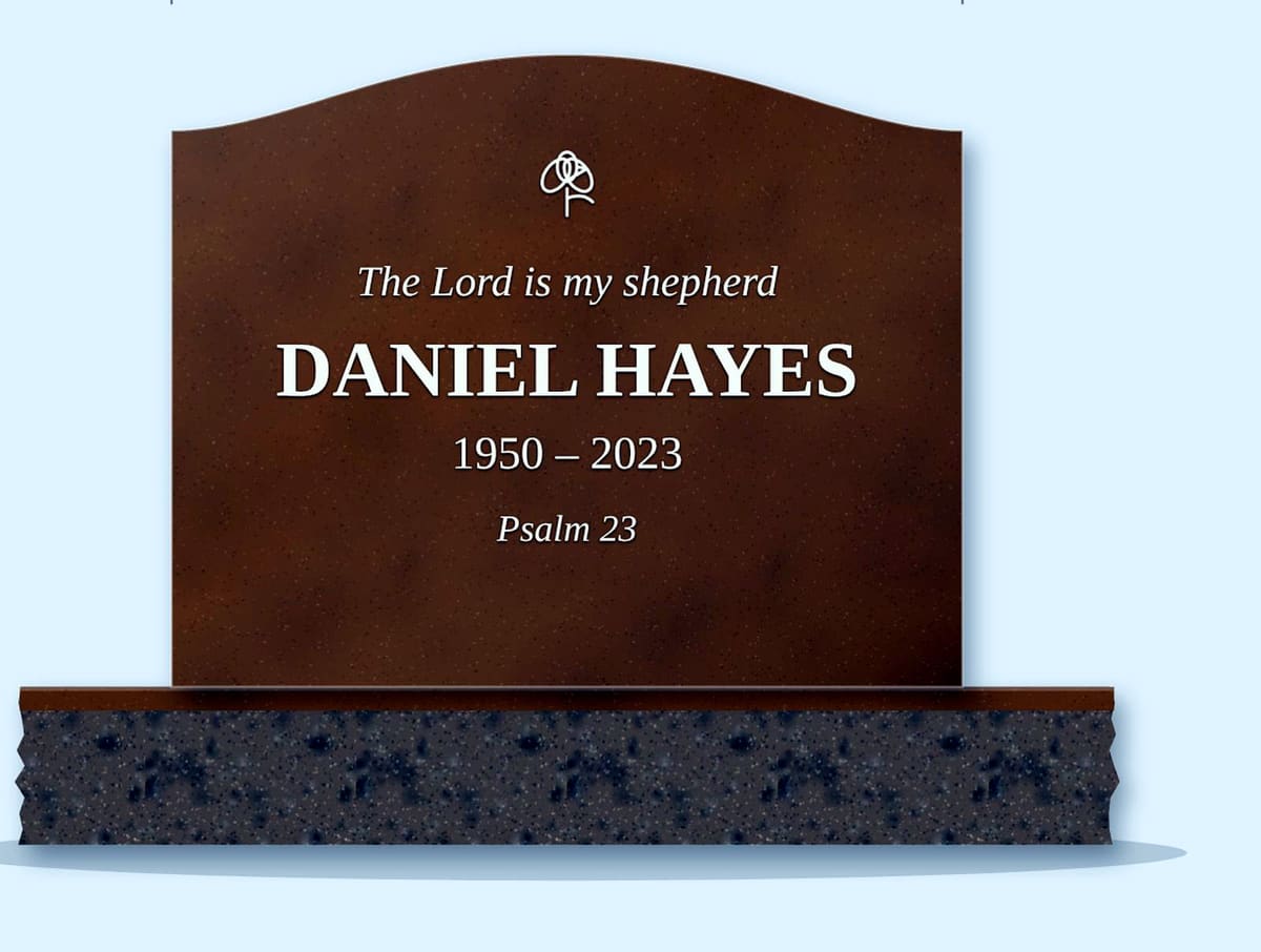 Tan Brown serpentine headstone on a granite base, engraved for Daniel Hayes