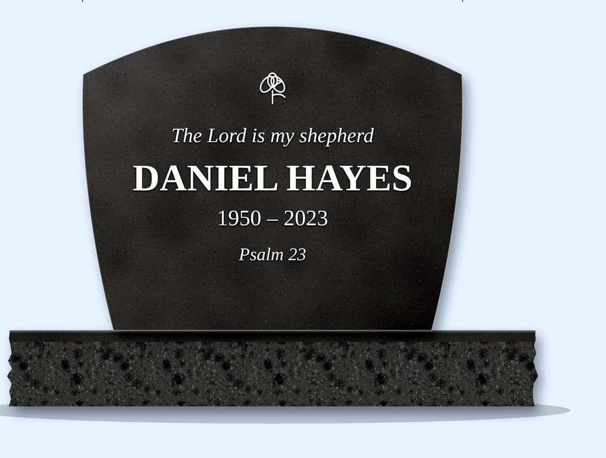 Steel Grey swoop headstone on a granite base, engraved for Daniel Hayes