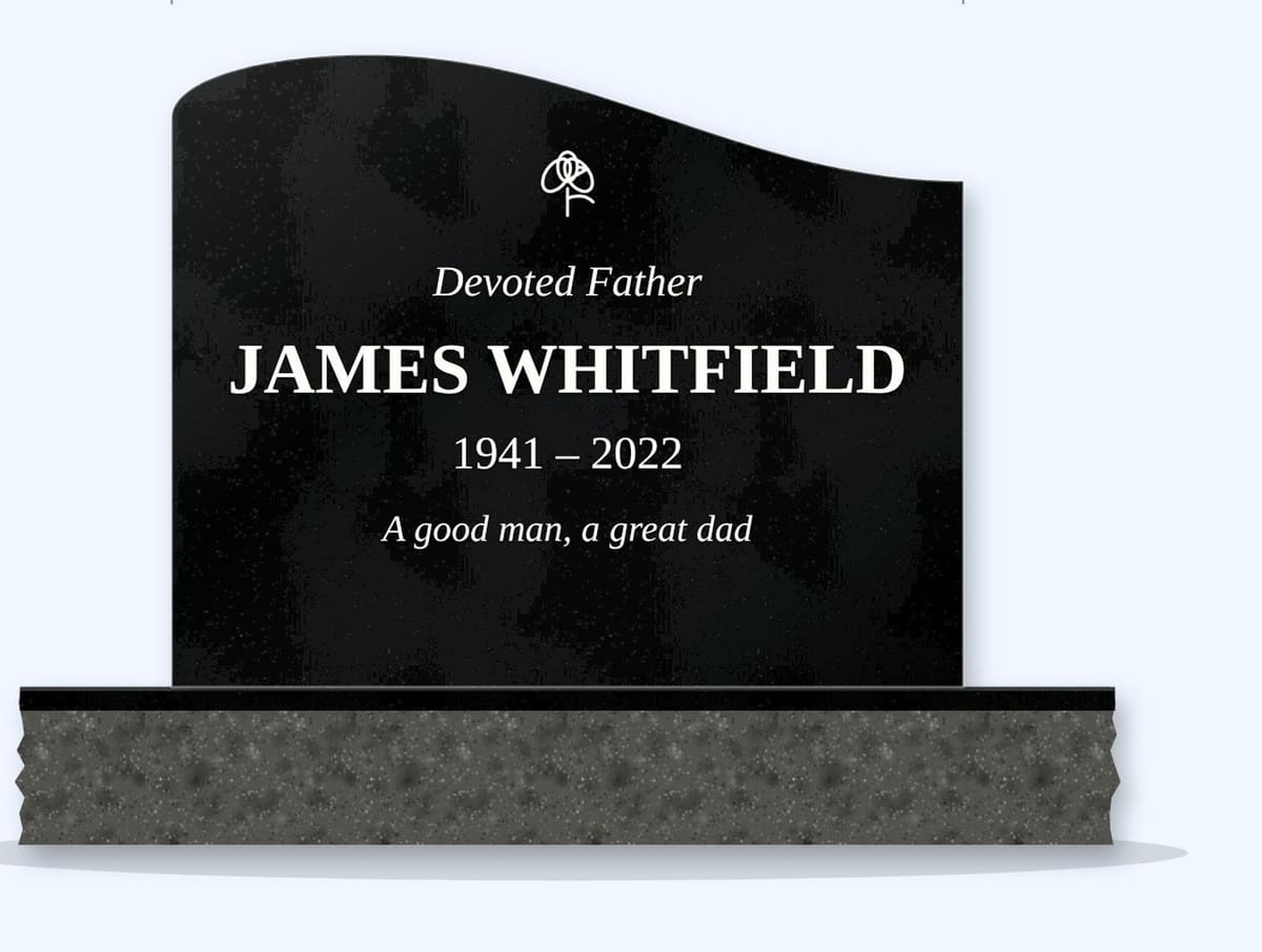 Absolute Black left wave headstone on a granite base, engraved for James Whitfield