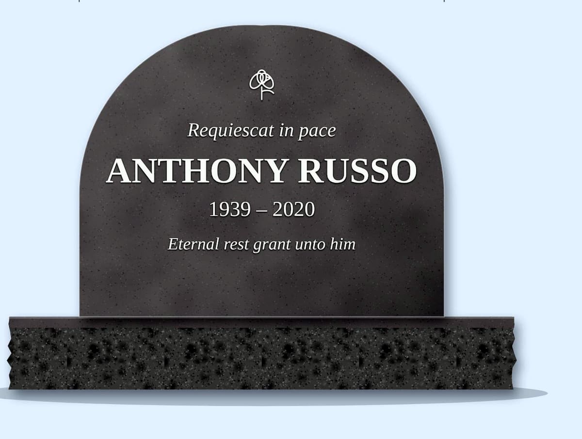 Indian Grey teardrop arch headstone on a granite base, engraved for Anthony Russo