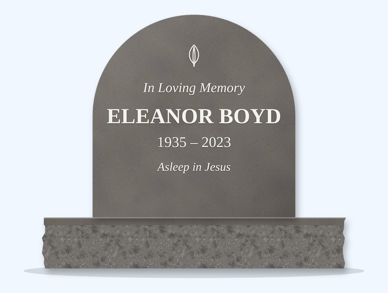 Grey half-round headstone on a granite base, engraved for Eleanor Boyd