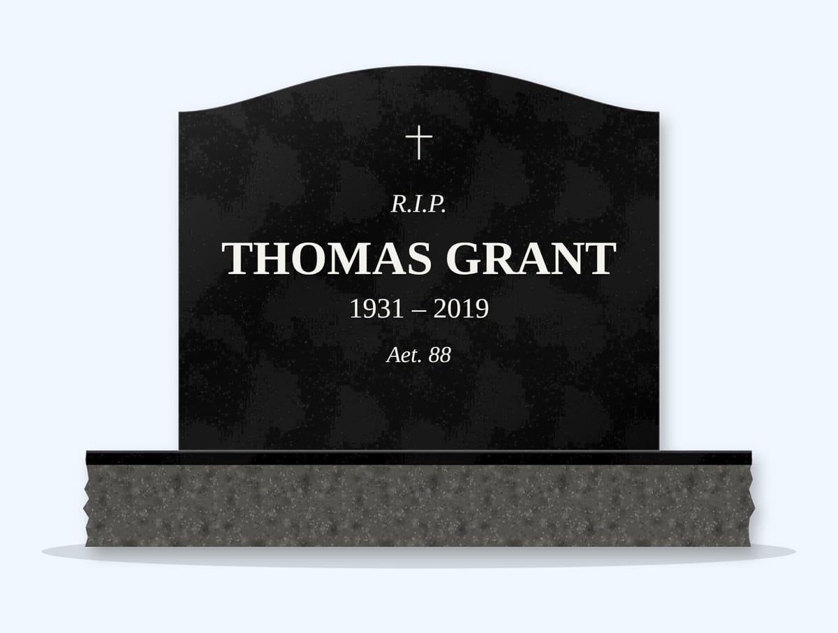 Absolute Black serpentine headstone on a granite base, engraved for Thomas Grant