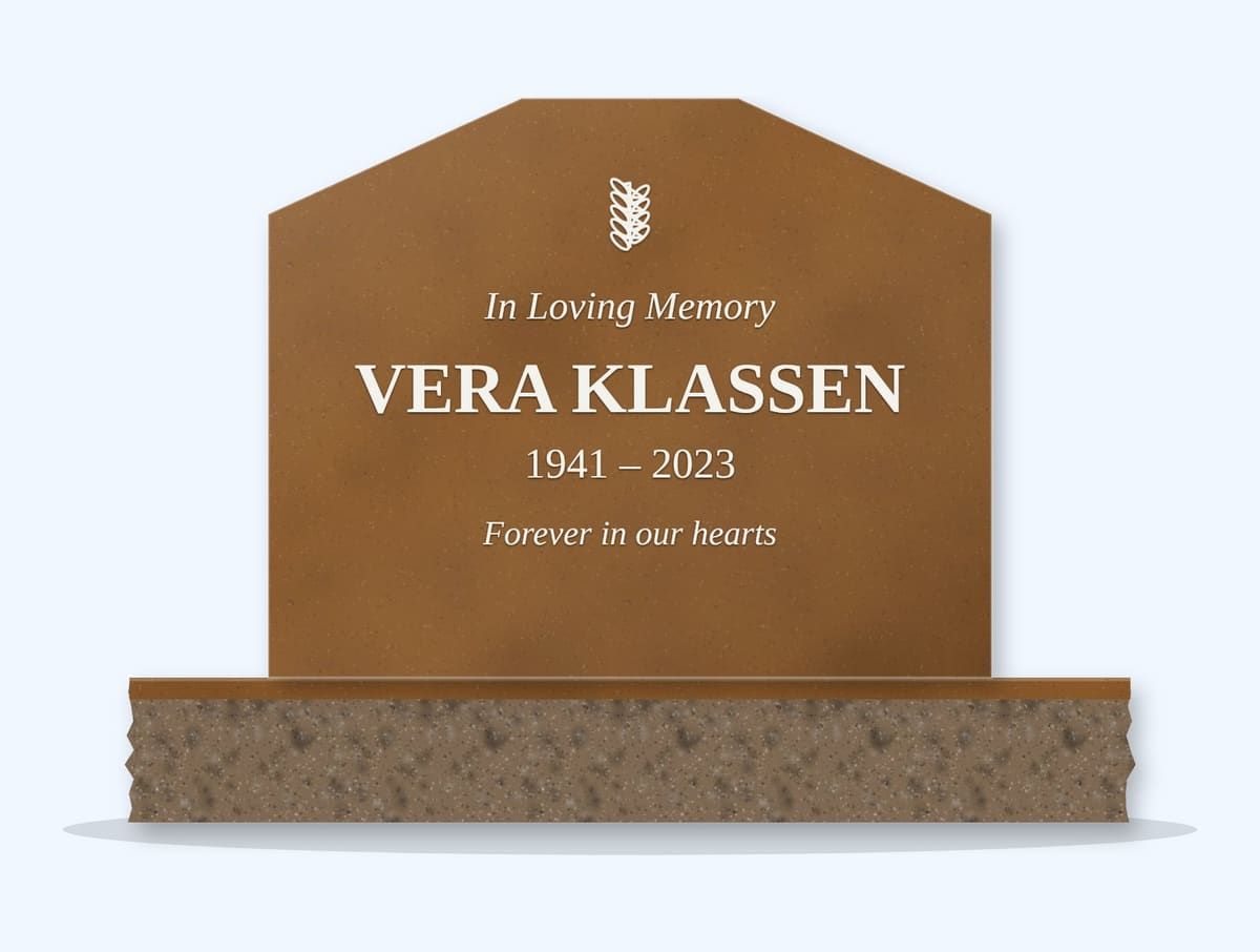 Tan Brown cropped peak headstone on a granite base, engraved for Vera Klassen