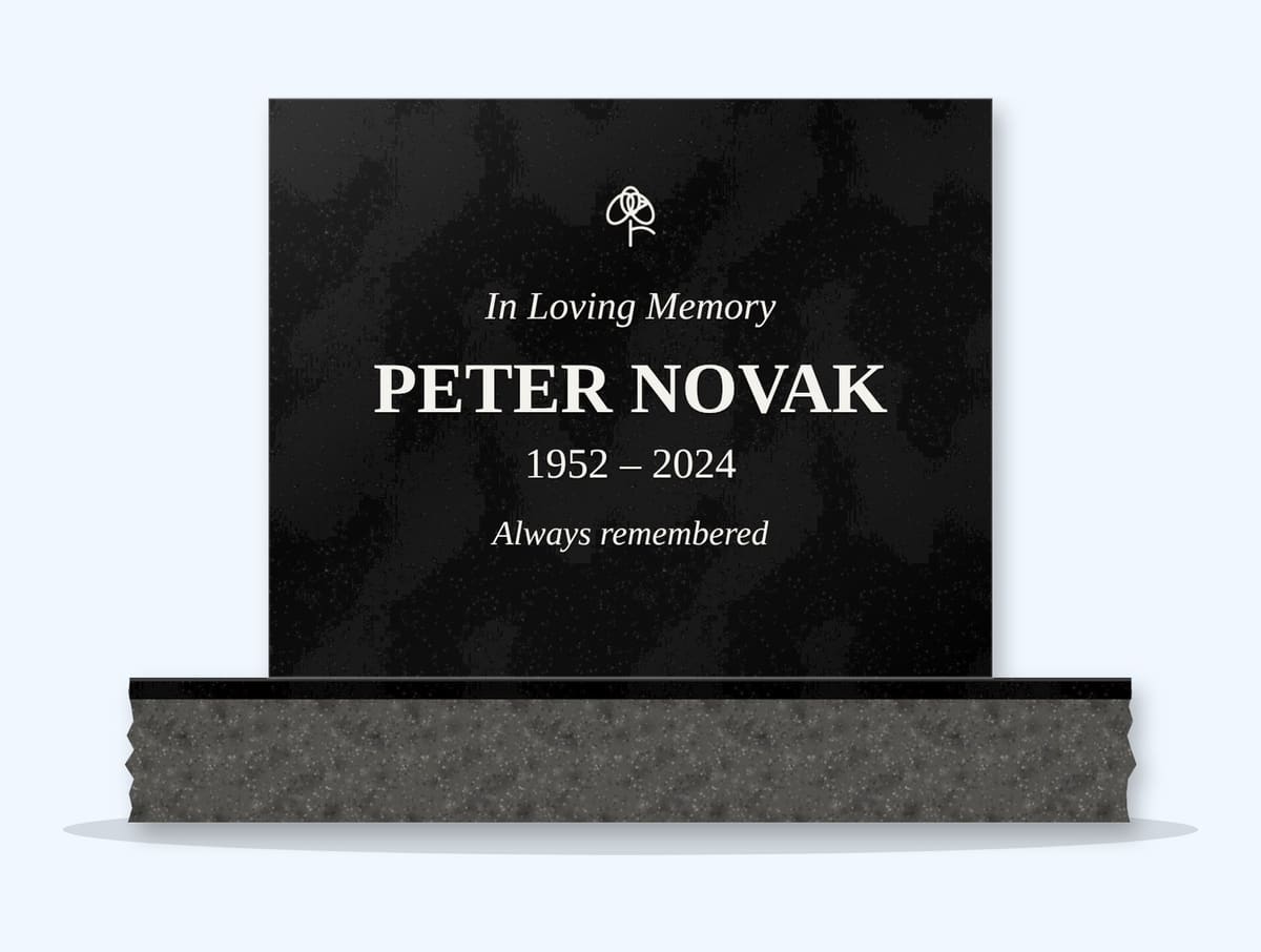 Absolute Black square headstone on a granite base, engraved for Peter Novak
