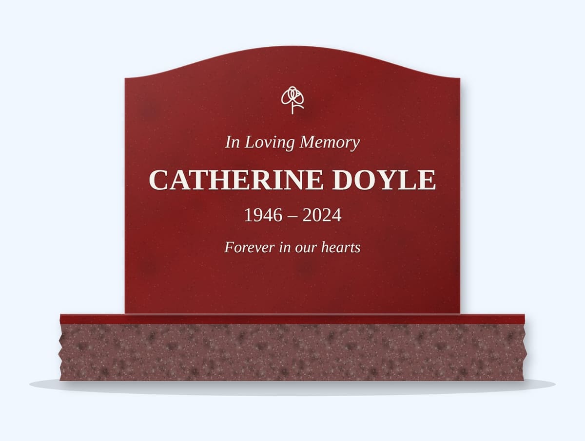 Indian Red serpentine headstone on a granite base, engraved for Catherine Doyle