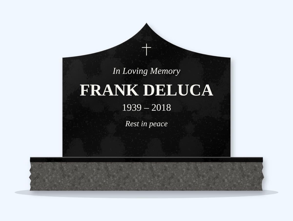 Absolute Black curved gable headstone on a granite base, engraved for Frank DeLuca
