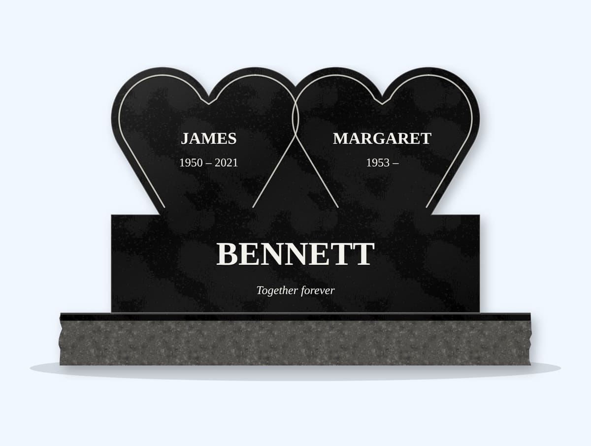 Absolute Black double heart companion headstone on a granite base, engraved for the Bennett Family