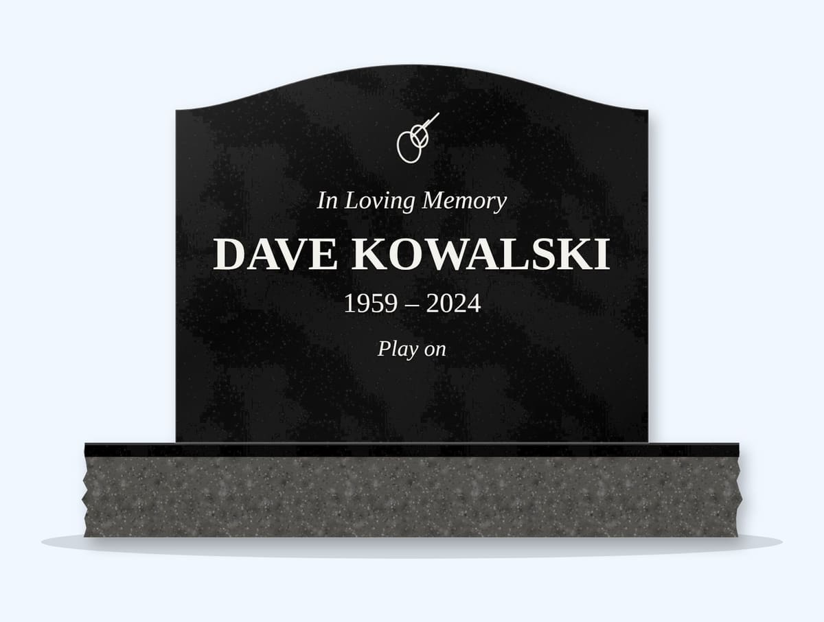 Absolute Black serpentine headstone on a granite base, engraved for Dave Kowalski