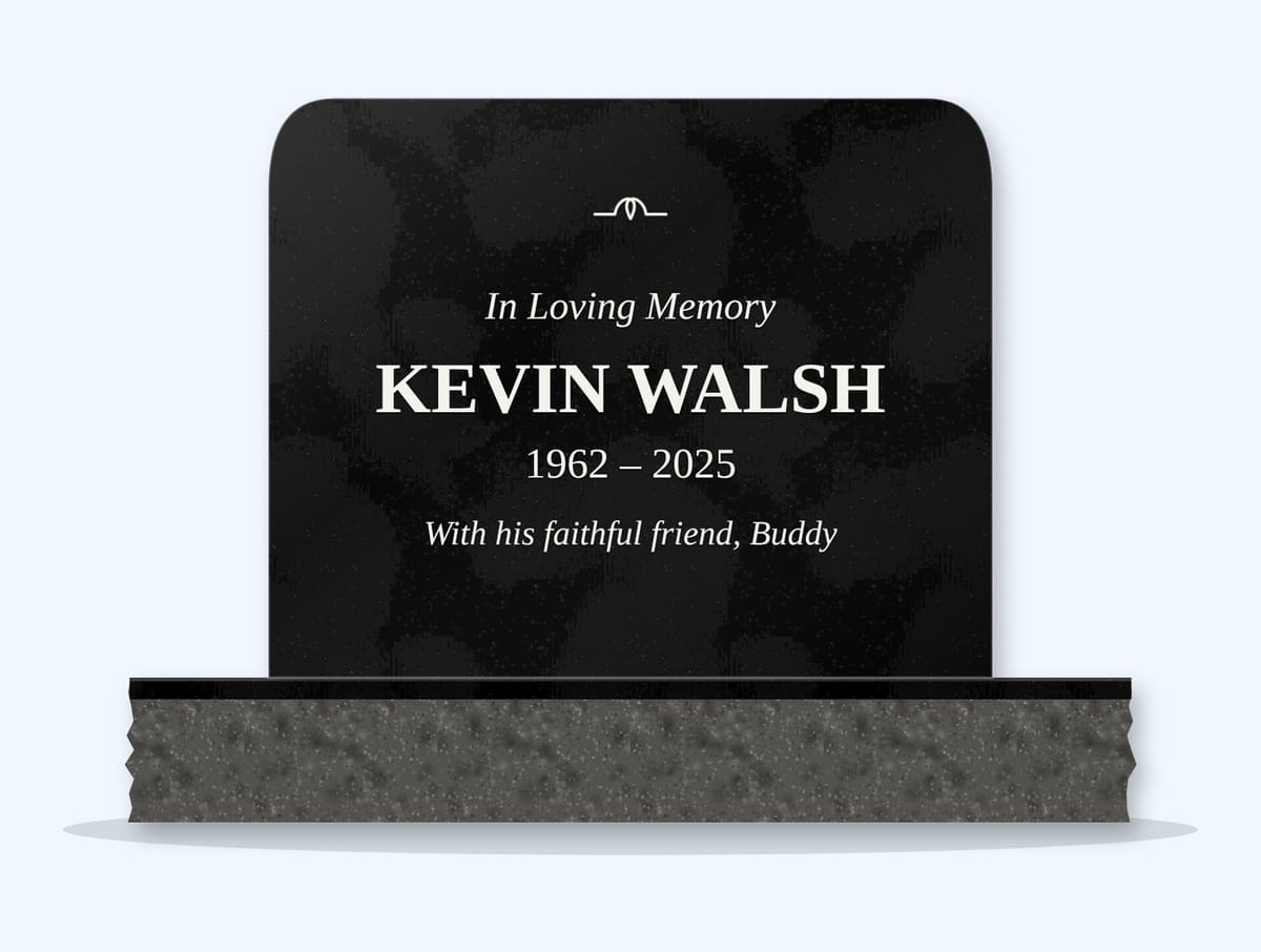 Absolute Black rounded top headstone on a granite base, engraved for Kevin Walsh