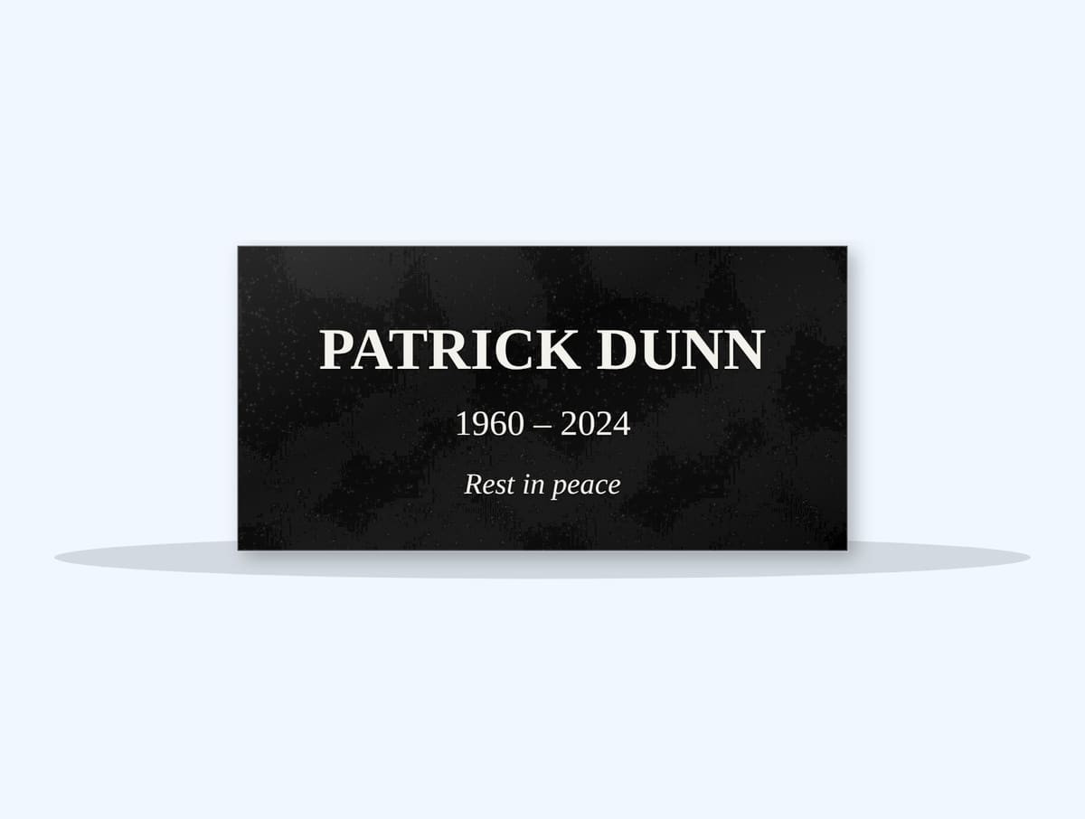 Absolute Black flat grave marker engraved for Patrick Dunn