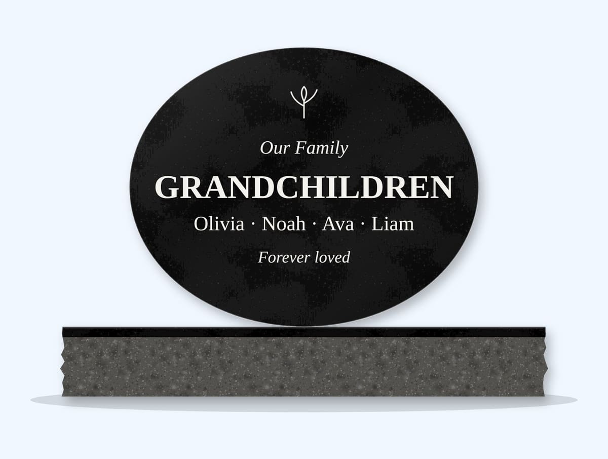 Absolute Black oval headstone on a granite base, engraved for the family's grandchildren