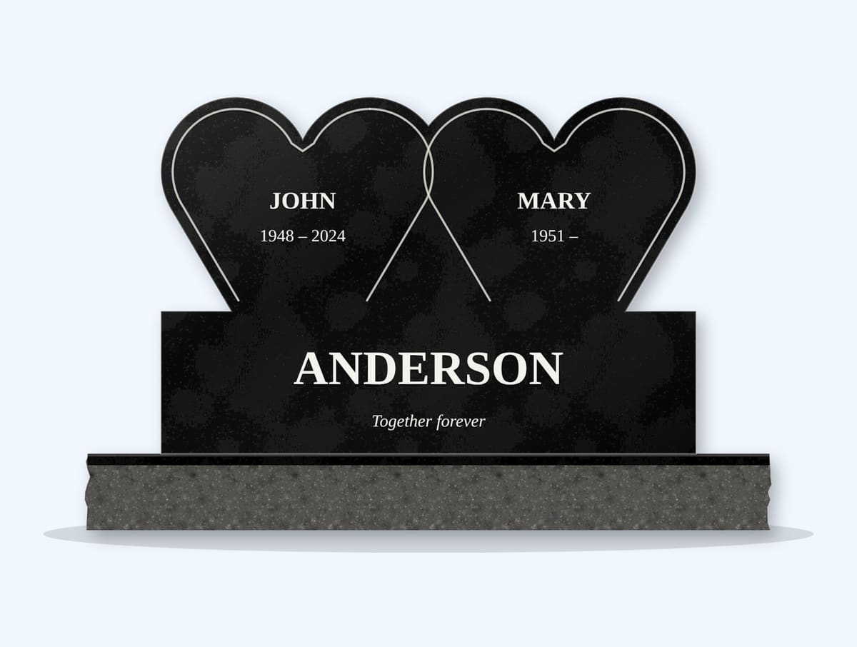 Absolute Black double heart companion headstone on a granite base, engraved for John and Mary