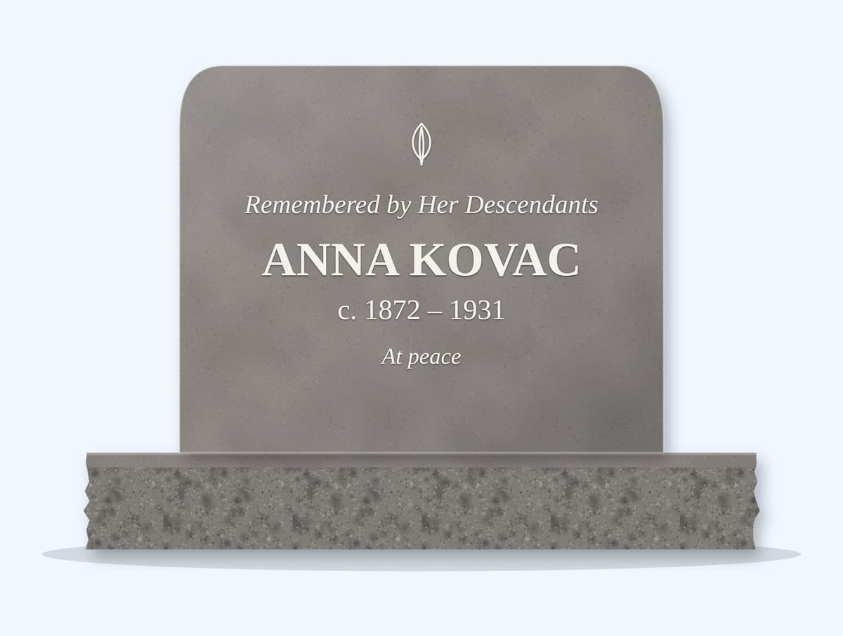Indian Grey rounded top headstone on a granite base, engraved for Anna Kovac