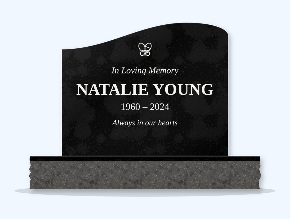 Absolute Black right wave headstone on a granite base, engraved for Natalie Young