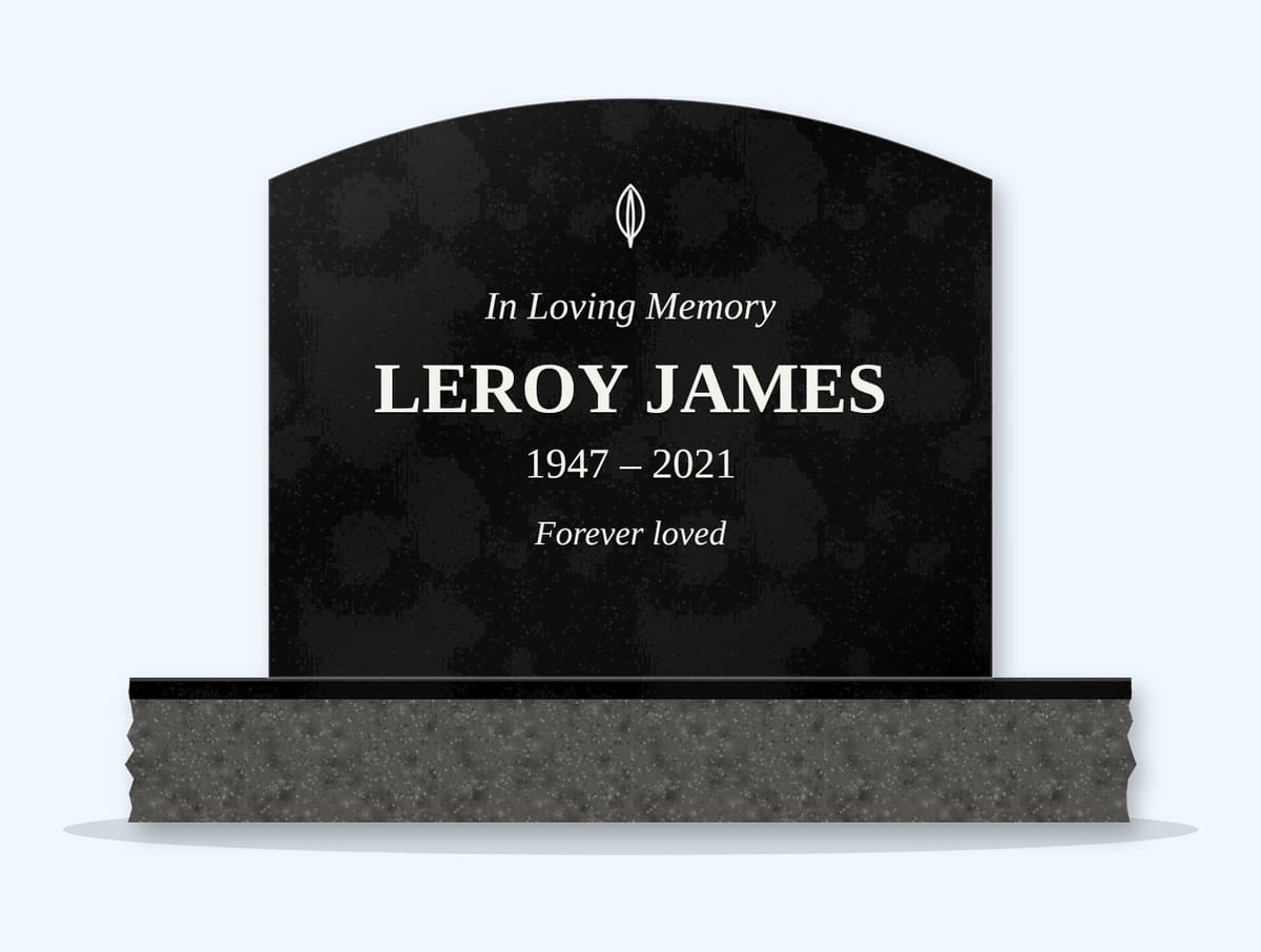 Absolute Black curved top headstone on a granite base, engraved for Leroy James