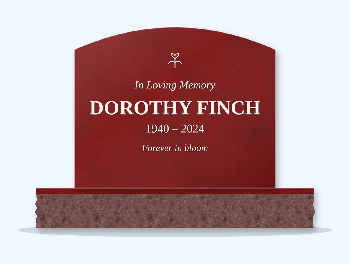 Indian Red curved top headstone on a granite base, engraved for Dorothy Finch