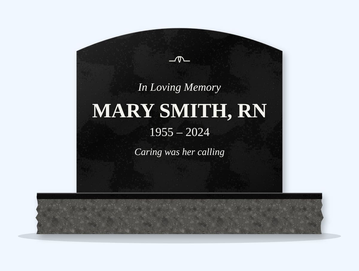Absolute Black curved top headstone on a granite base, engraved for Mary Smith