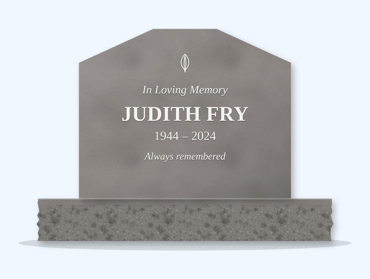 Indian Grey cropped peak headstone on a granite base, engraved for Judith Fry