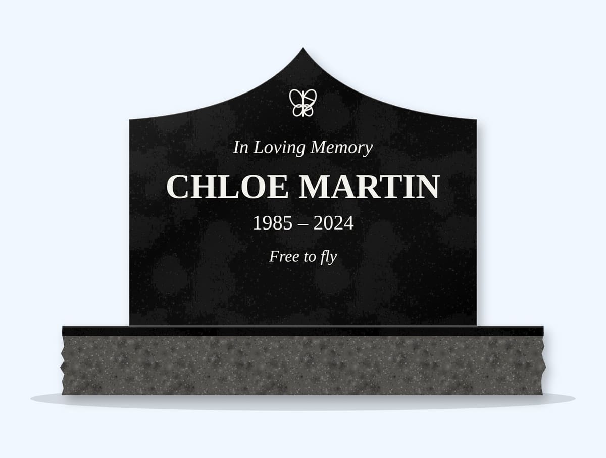 Absolute Black curved gable headstone on a granite base, engraved for Chloe Martin