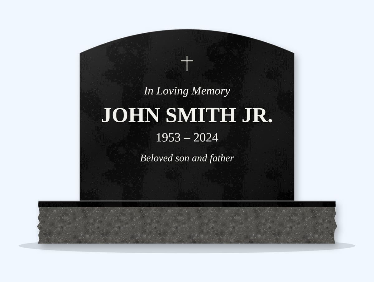Absolute Black curved top headstone on a granite base, engraved for John Smith Jr.