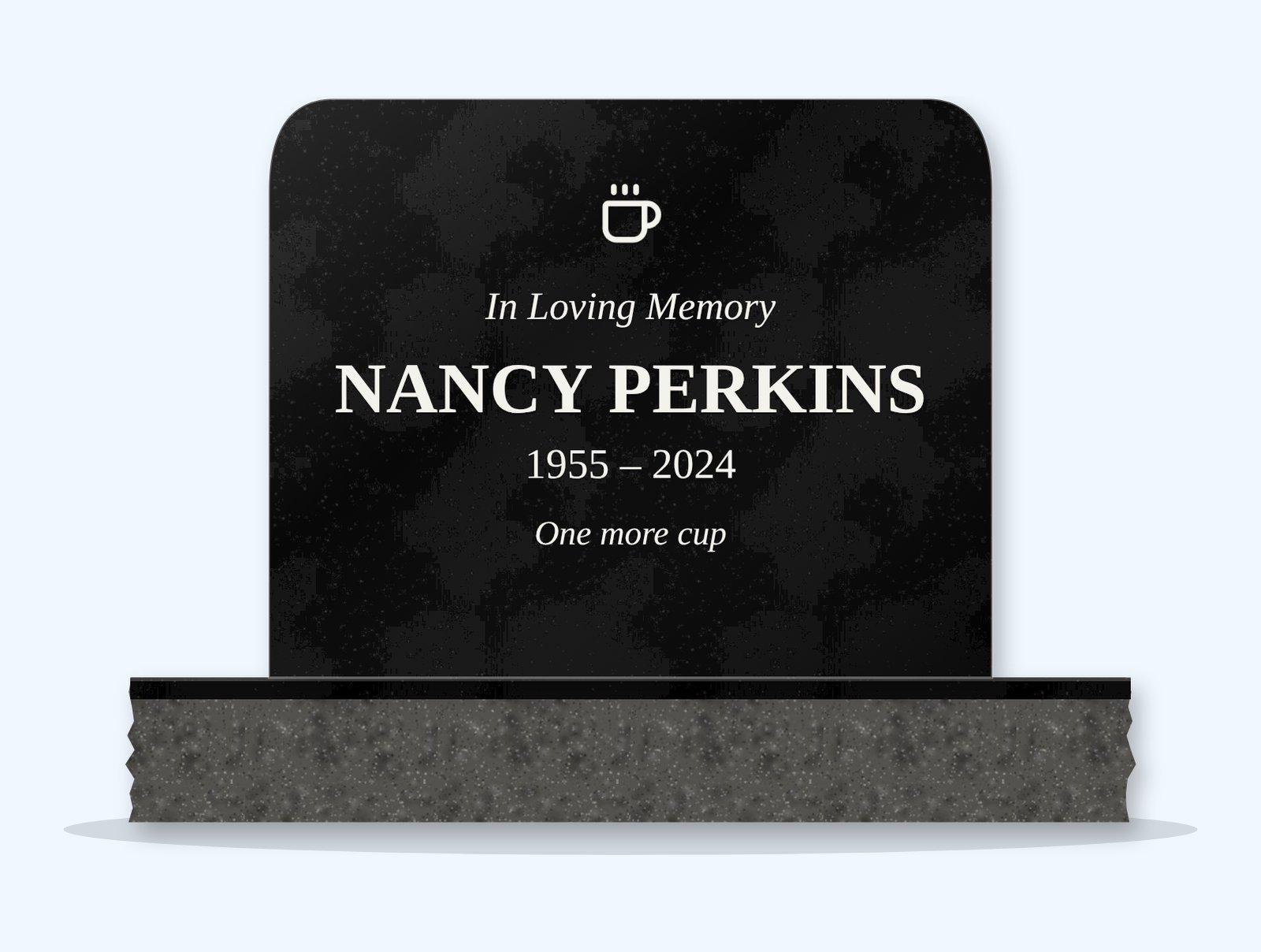 Absolute Black rounded top headstone on a granite base, engraved for Nancy Perkins