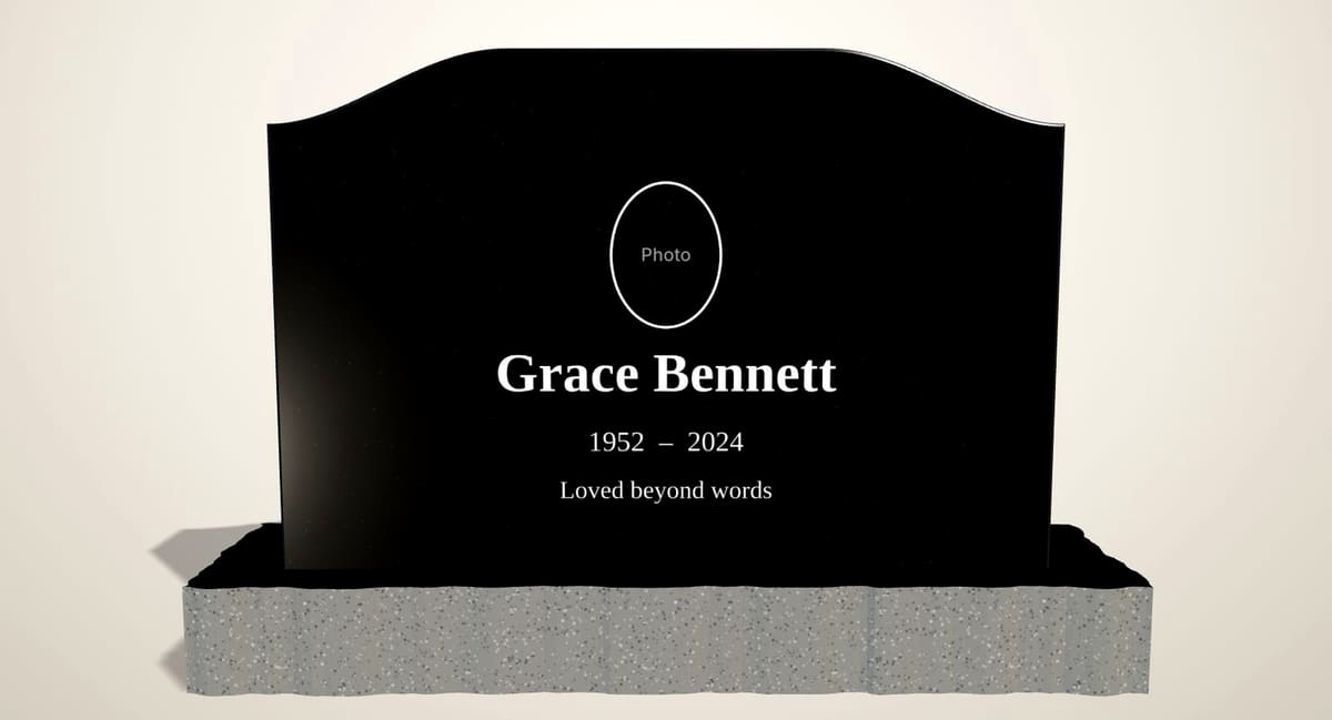 Black granite serpentine headstone with an oval photo panel above the name and dates