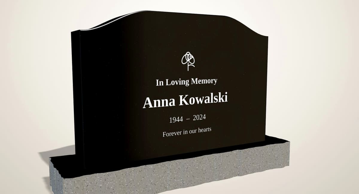 Polished black granite serpentine upright headstone on a rock-pitched base, three-quarter view